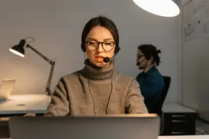 Customer support worker wearing a headset